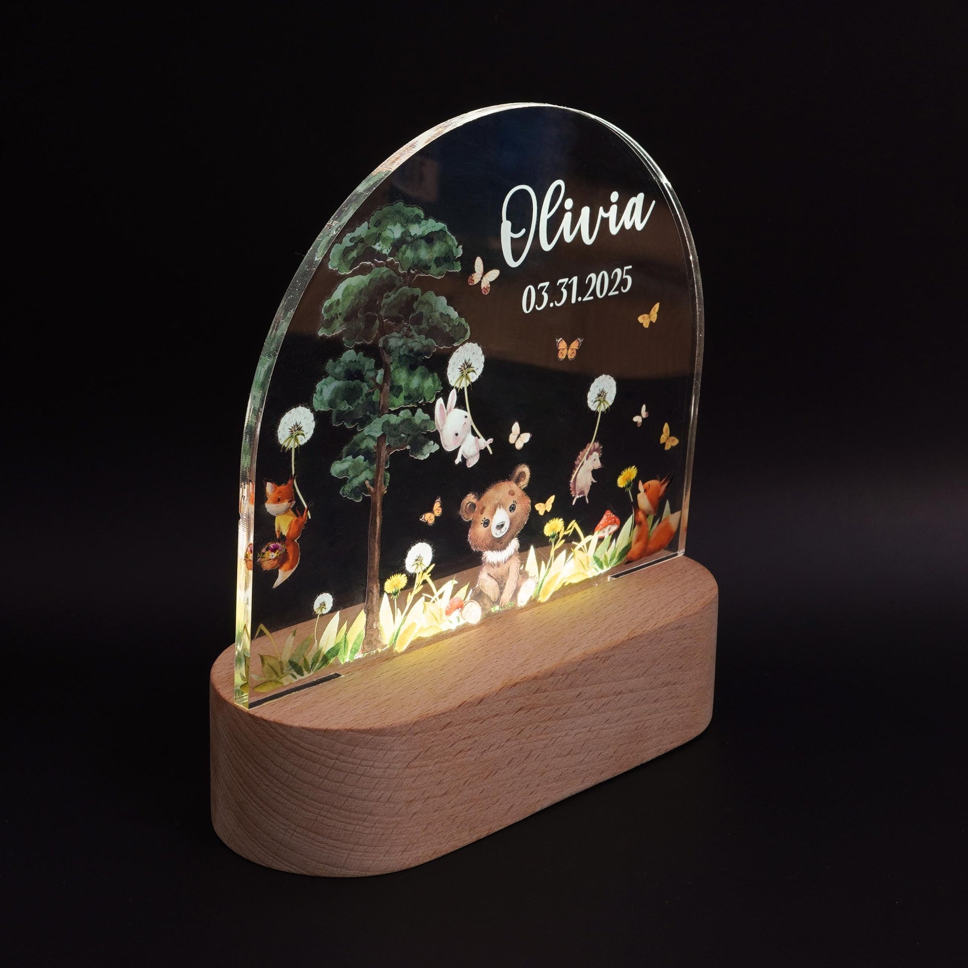 Forest animal night light glowing warm white in a nursery